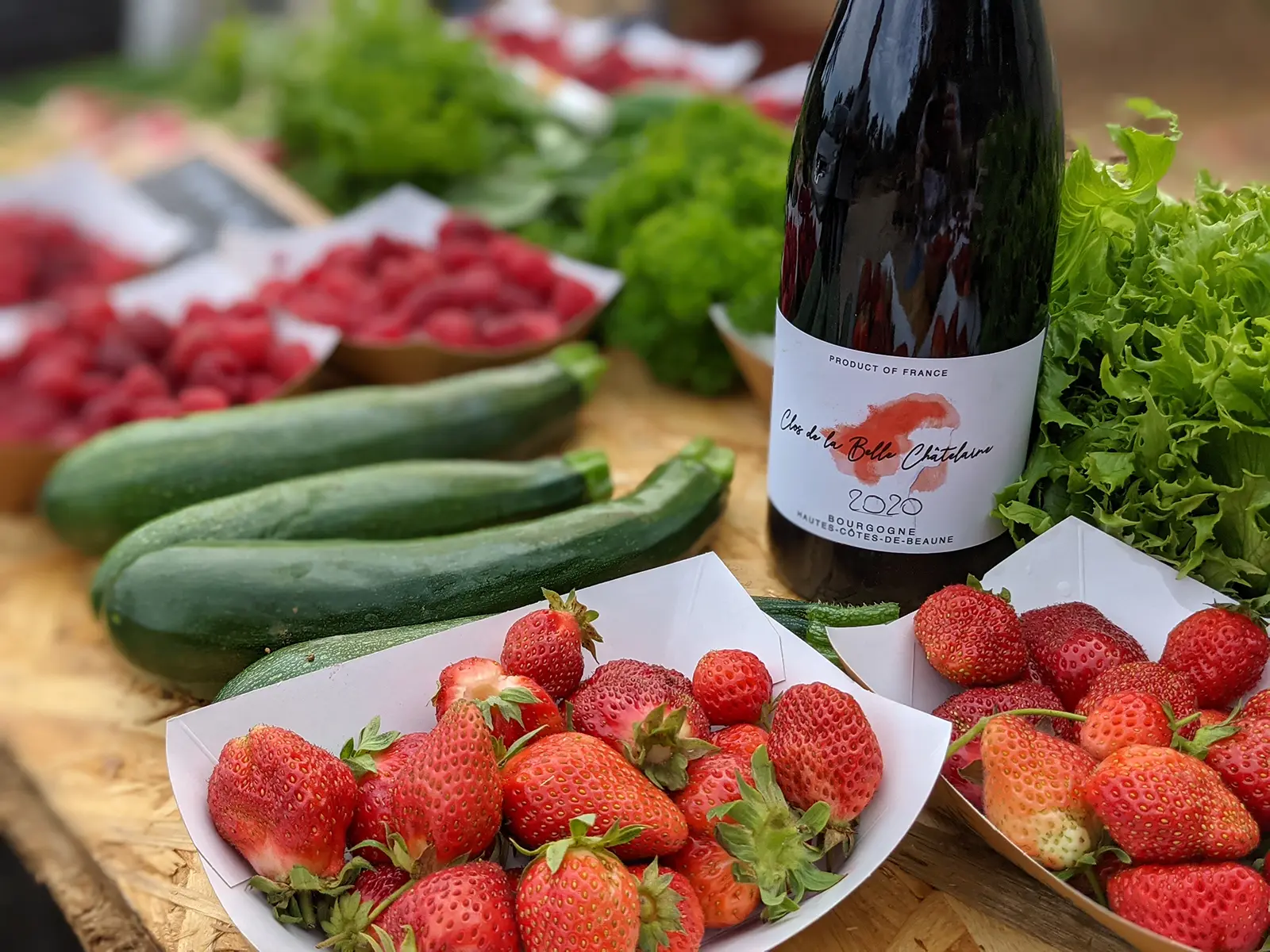 A bottle of wine from the Clos among the vegetables